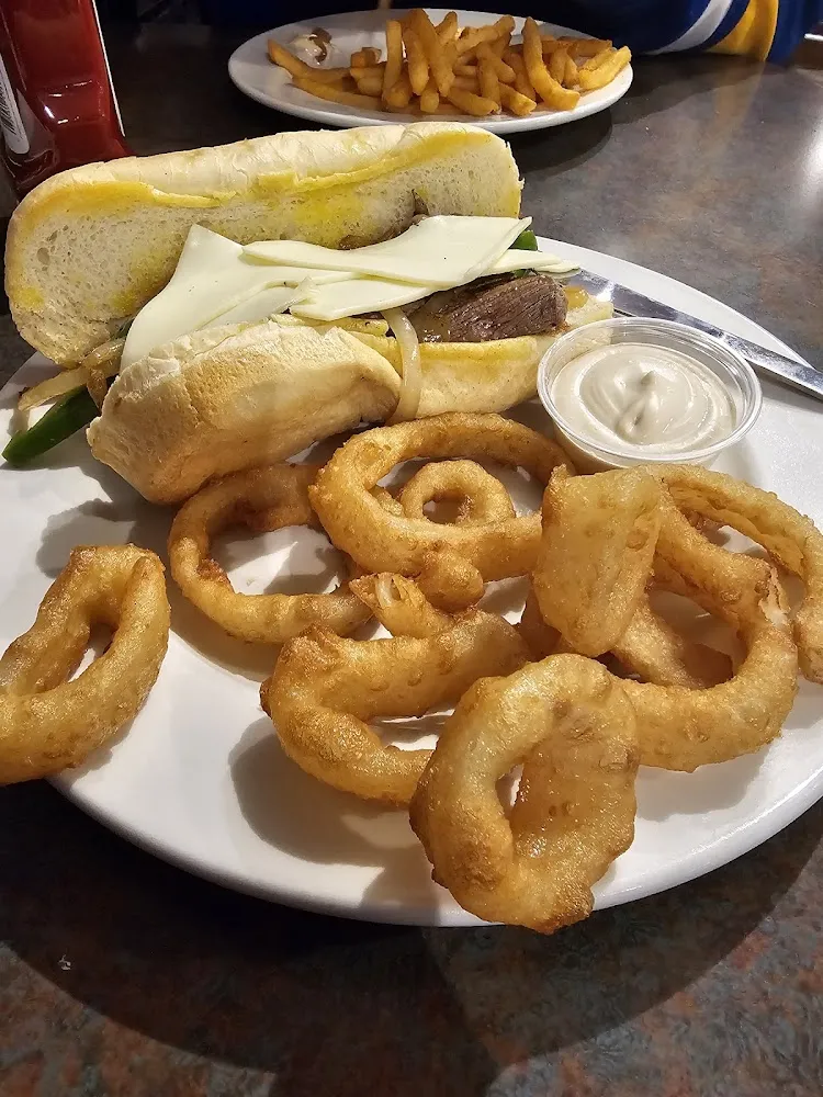 Steak Sandwich with Grilled Onions Peppers and Mushrooms